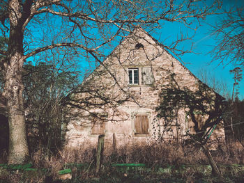 Low angle view of old building against sky