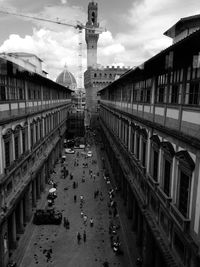 High angle view of people in city against sky