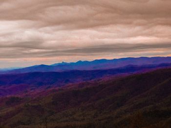 Scenic view of mountains against dramatic sky