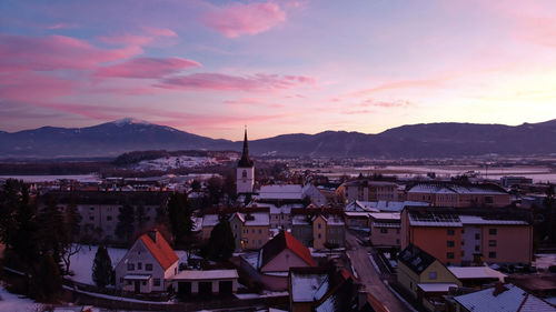 High angle shot of townscape against sky at sunset