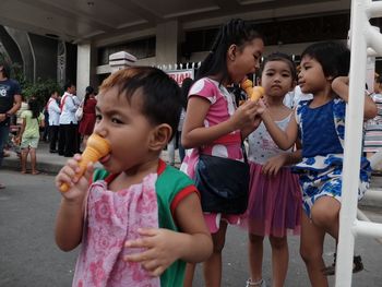 Children standing in traditional clothing