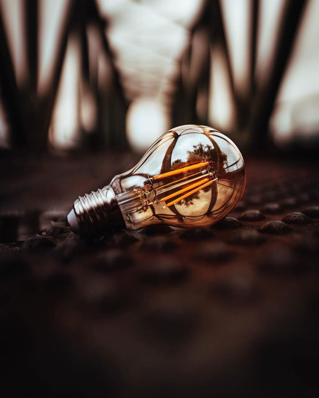 close-up, macro photography, selective focus, ring, no people, indoors, black, yellow, light, fashion accessory, focus on foreground