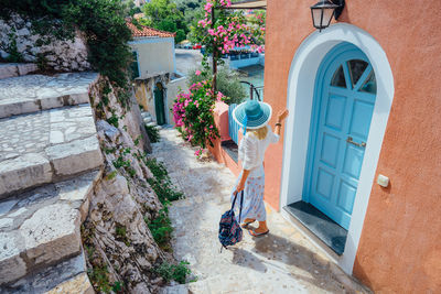 Woman by building entrance