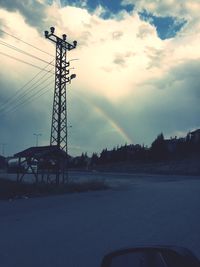 Scenic view of rainbow over city