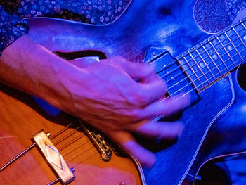 High angle view of playing guitar