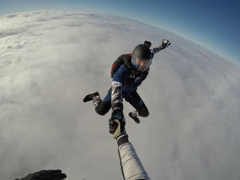 Low angle view of man standing on snow