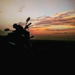 Silhouette horse against sky at sunset