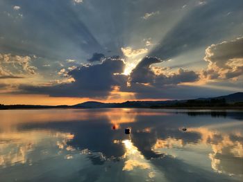 Scenic view of lake against sky during sunset