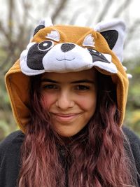 Close-up portrait of young woman wearing hood