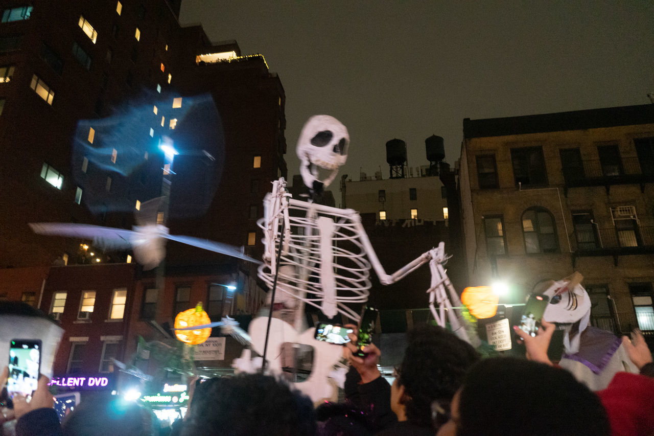 night, crowd, group of people, large group of people, technology, celebration, event, architecture, photographing, performance, illuminated, arts culture and entertainment, adult, men, wireless technology, person, city, communication