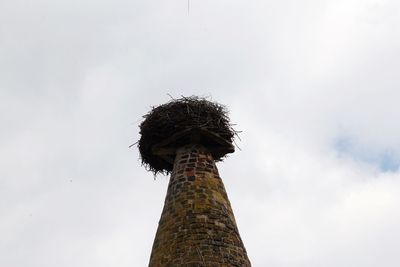 Low angle view of bell tower against sky