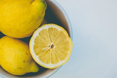 Close-up of lemon slice on wooden table