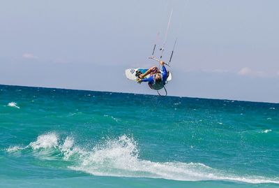 People surfing in sea