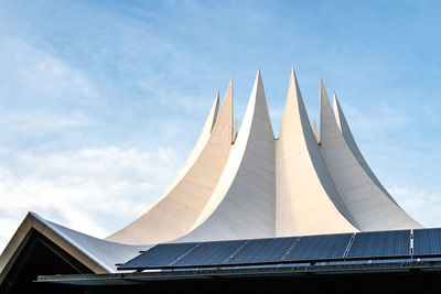 Tempodrom - low angle view of modern building against cloudy sky