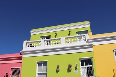 Low angle view of building against clear blue sky