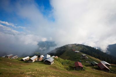 Scenic view of landscape against cloudy sky