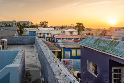 High angle view of buildings against sky at sunset