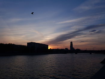 Silhouette of buildings at waterfront