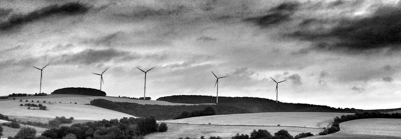 Scenic view of landscape against cloudy sky