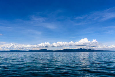 Scenic view of sea against blue sky