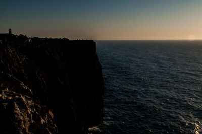 Scenic view of sea against clear sky during sunset