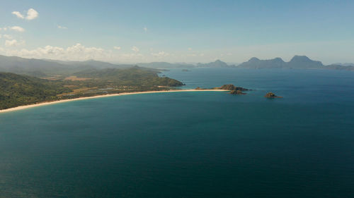 Seascape with tropical islands, mountains and beaches. nacpan, el nido, palawan, philippines. 