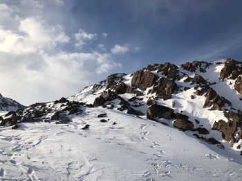 Snow covered mountains against sky