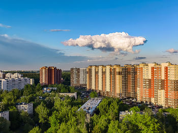 Buildings in city against sky