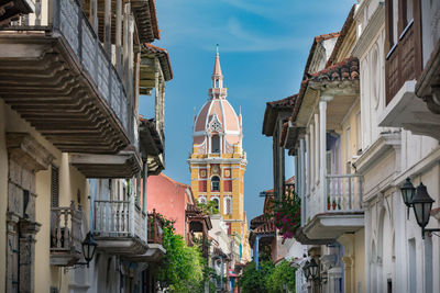 Low angle view of buildings in city against sky