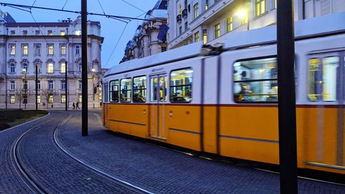 Train on railroad track in city