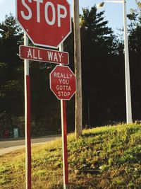 Road sign against sky