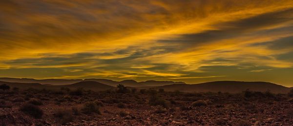 Scenic view of dramatic sky during sunset