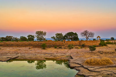 Scenic view of landscape against sky during sunset