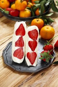 Japanese strawberry fruit sandwich fruit sando on wooden table.  viral popular food on social media