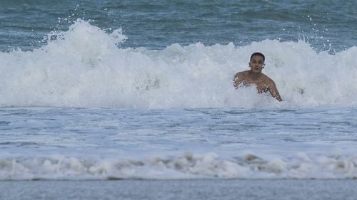 Man swimming in sea