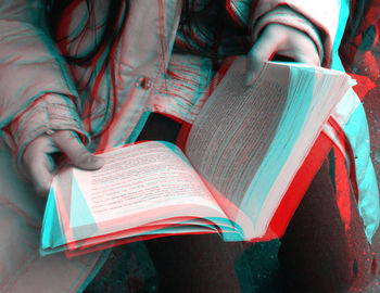 Double exposure image of woman reading book