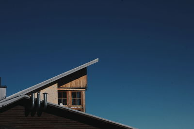 Low angle view of building against blue sky