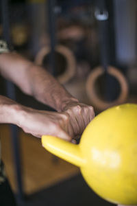 Close-up of person hand holding ball
