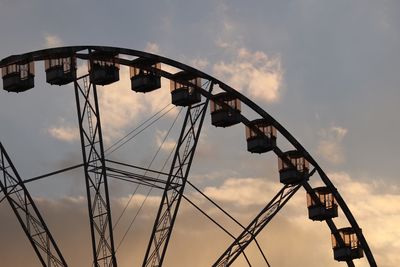 Low angle view of ferris wheel against sky