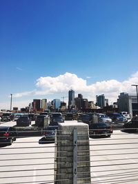 View of cityscape against blue sky