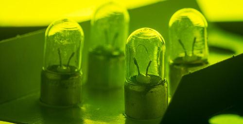 Close-up of green bottles on table