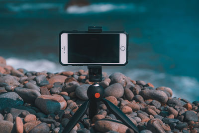 Close-up of camera on rock