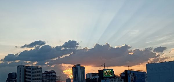 Low angle view of buildings against sky during sunset