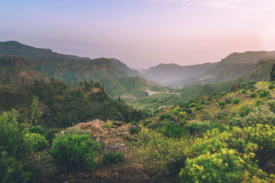 Scenic view of mountains against sky during sunset