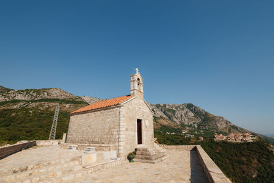 Historic building against clear blue sky