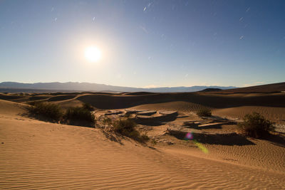 Scenic view of desert against clear sky