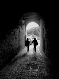 People walking in tunnel