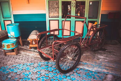 Bicycles parked on brick wall