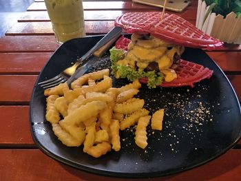 High angle view of vegetables in plate on table