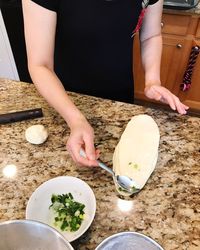 Midsection of woman preparing food